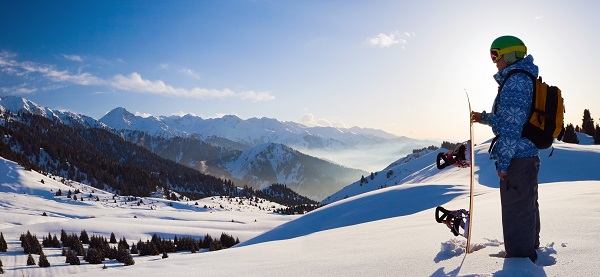 Sport woman in snowy mountains