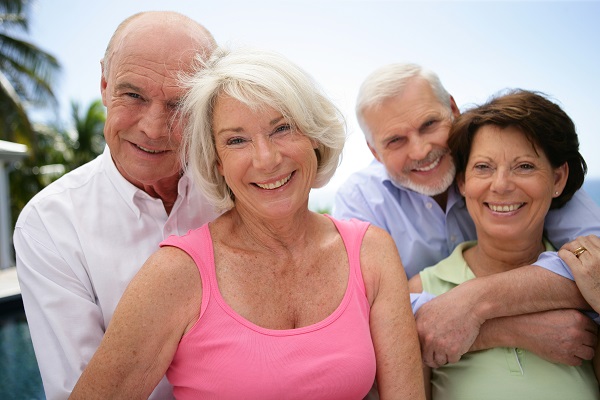 two happy senior couples