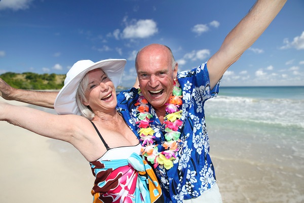 Happy senior couple at tropical beach