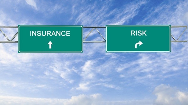Road signs pointing towards Insurance and Risk
