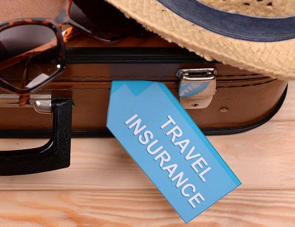 Stock-Picture-Suitcase-Travel-Insurance-Tag