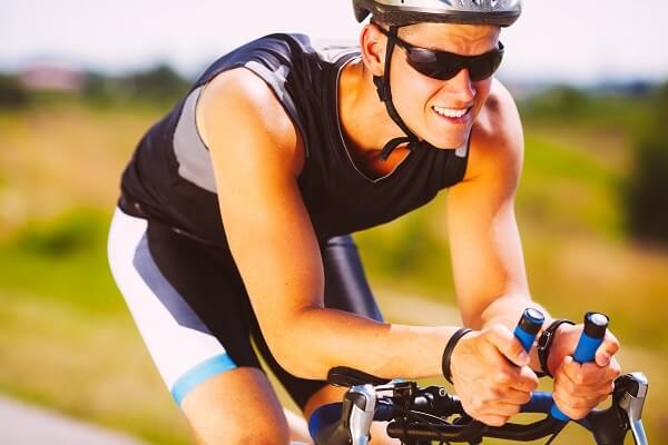 Man completing Triathlon on bike