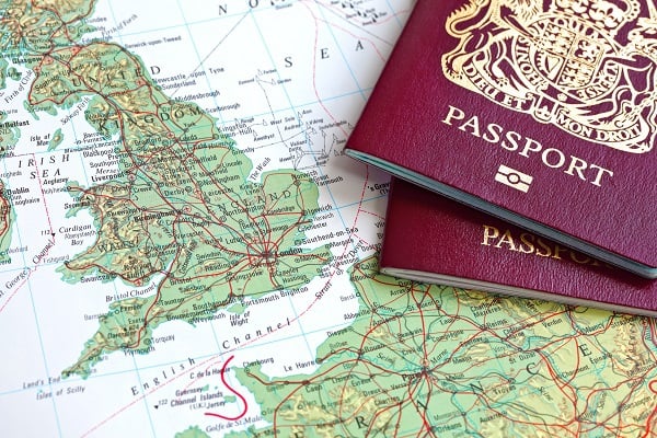Two passports on map of UK