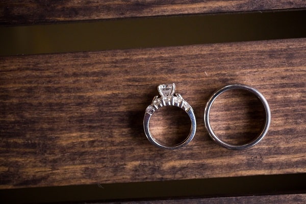 Flatlay-Wedding-Rings-Wooden-Background