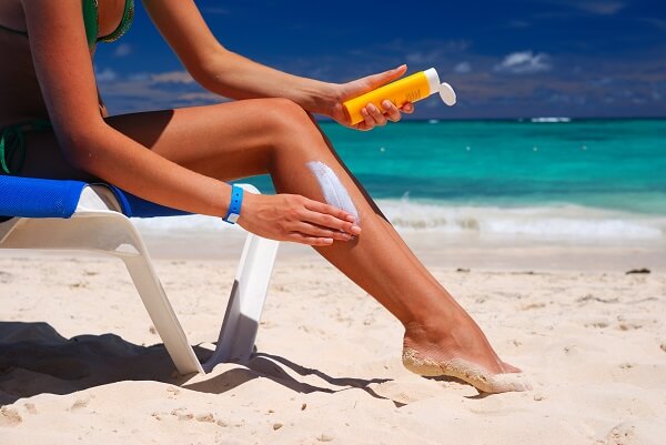 Stock-Picture-Woman-Applying-Suncream