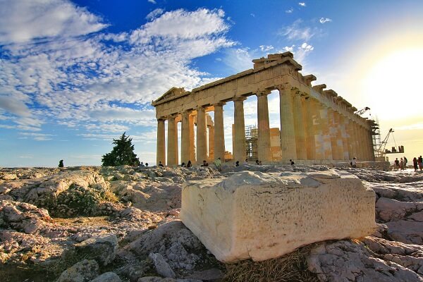 greek historical ruins with blue sky in background